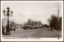 26 - Boulogne (Seine) L'avenue de la Reine - La rue de Paris, Boulogne-Billancourt. route de la Reine - rue de Paris . - perspective - Perspective sur la rue de Paris à gauche et sur la route de la Reine à droite. - Au 1er plan, à gauche, un candélabre.