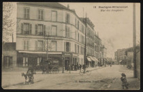 12 - Boulogne-Billancourt - Rue des Peupliers, Boulogne-Billancourt . rue des Peupliers . - perspectiveAu premier plan, à gauche, une femme avec une chèvre et un chevreau, à droite, une fillette. Au centre, croisement avec l'avenue Pierre Grenier.Au second plan, à gauche, une hippomobile de l'entreprise Lemaire devant le commerce de vins-restaurant Parrain, au centre, un vélocycliste.