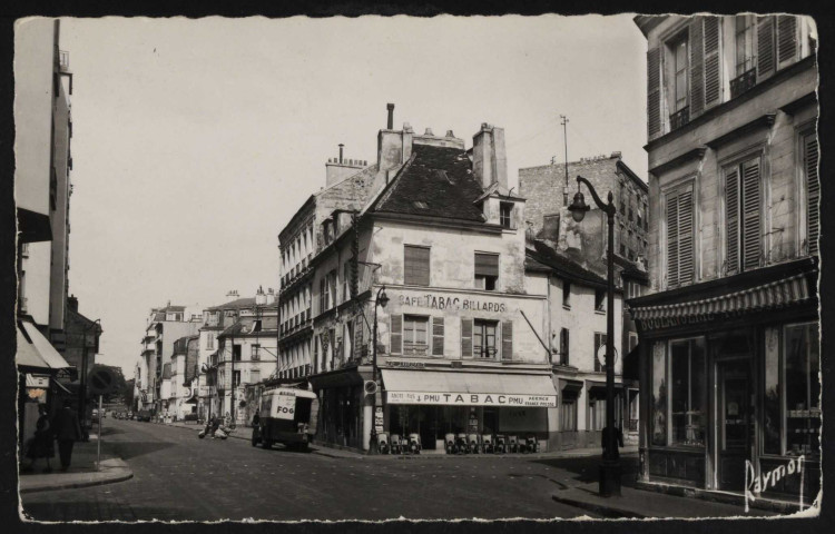 Images de France, Boulogne (seine) Carrefour Av. J-B Clément et La Rochefoucault, Boulogne-Billancourt . avenue Jean-Baptiste Clément, rue de la Rochefoucauld . - perspectiveA gauche l'avenue Jean-Baptiste Clément, à droite la rue de la Rochefoucauld.Au centre, le café-tabac "Le Lutetia", une camionnette sur le côté.A droite, une boulangerie puis la rue de la Rochefoucauld.